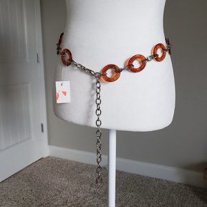 Beautiful Amber color ring and silver chain belt.